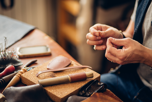 man working with leather