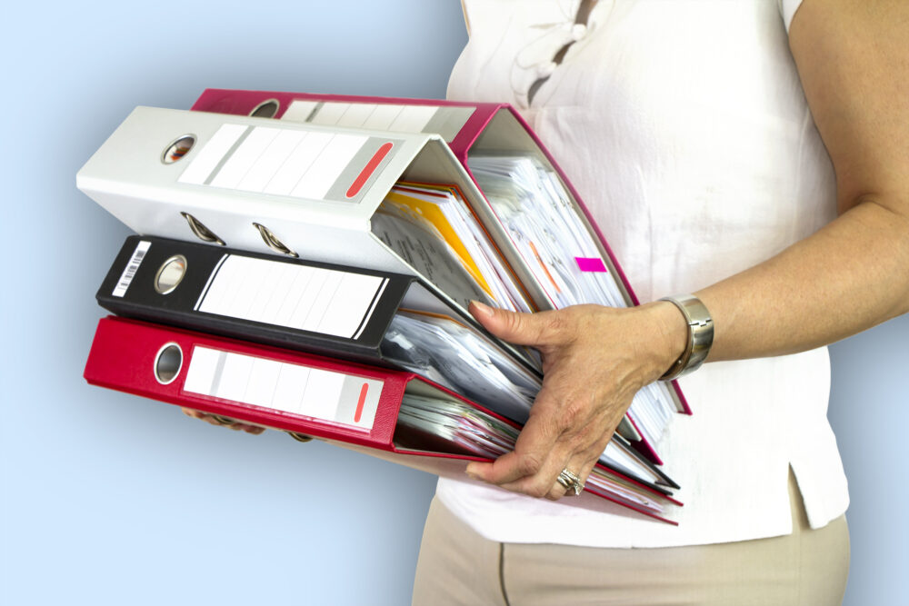 Holding folders containing business plan
