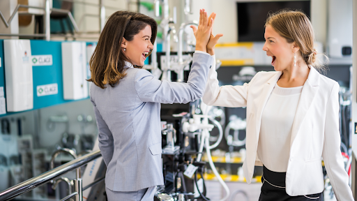 two women high five